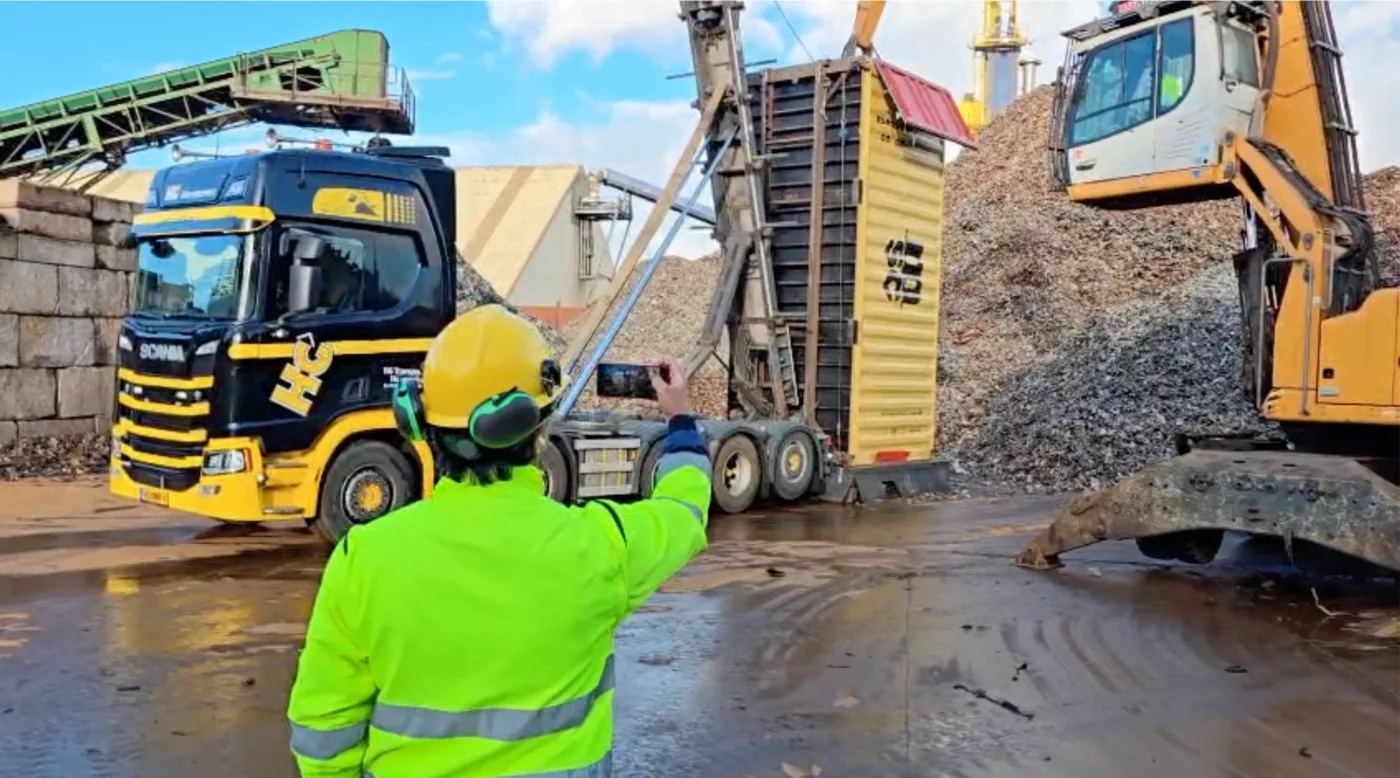 Inspector recording a metal scrap container loading operation at Kamienica Poland