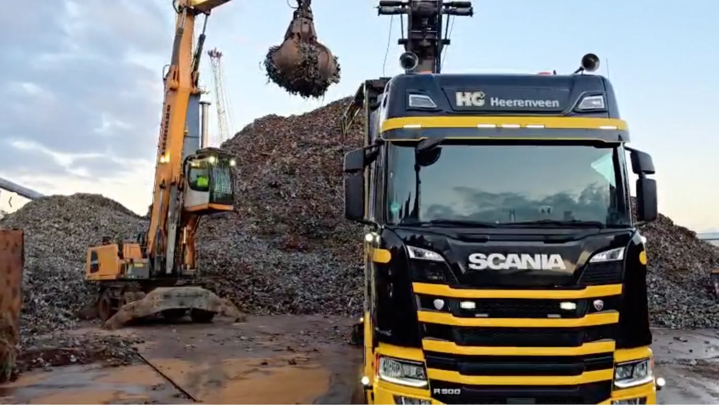 Scania truck and material handler working at a scrap yard in Kamienica Poland